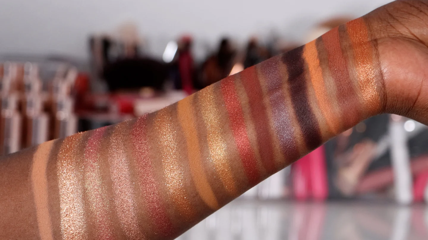 Top 5 Eyeshadow Palettes of 2024 - Must-Have Shades 1 Hand showing multiple eyeshadow swatches in different shades.