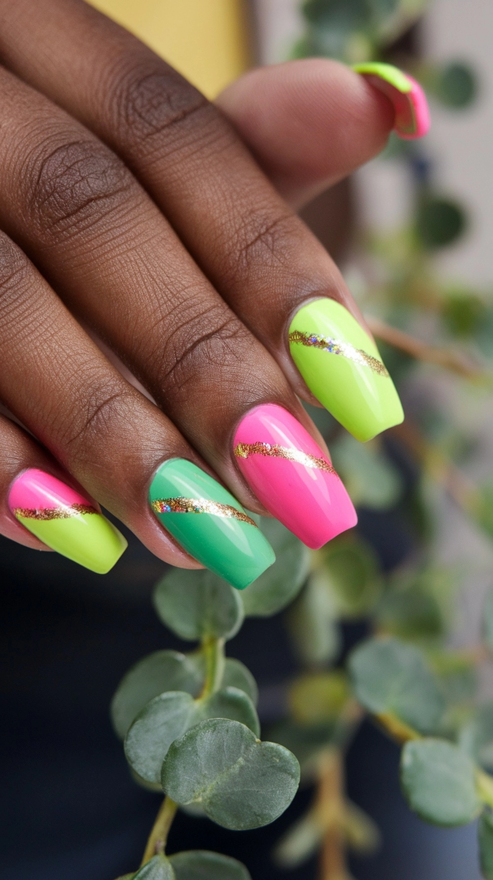 Bright and vibrant summer coffin nails in pink, green, and yellow