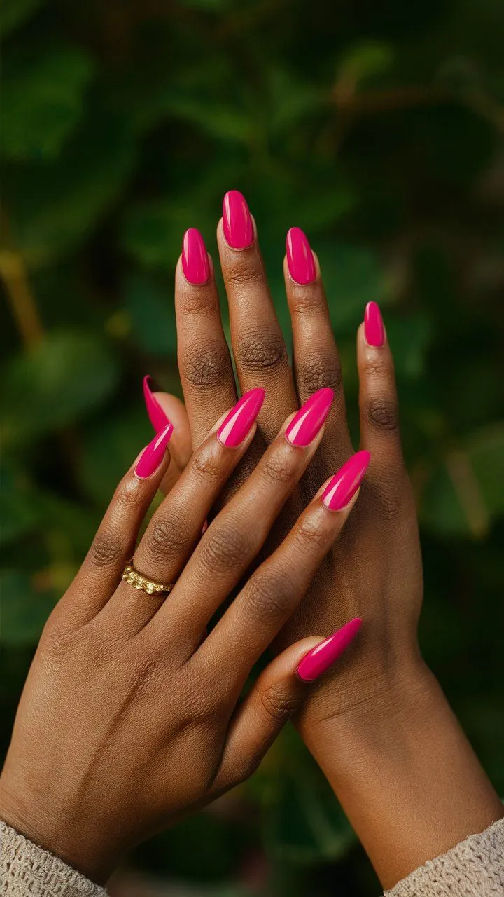 This image showcases vibrant pink nail colors, radiating energy and joy. The nails are adorned with a cheerful and bright pink hue, perfect for expressing your unique style and adding a pop of color to any outfit.