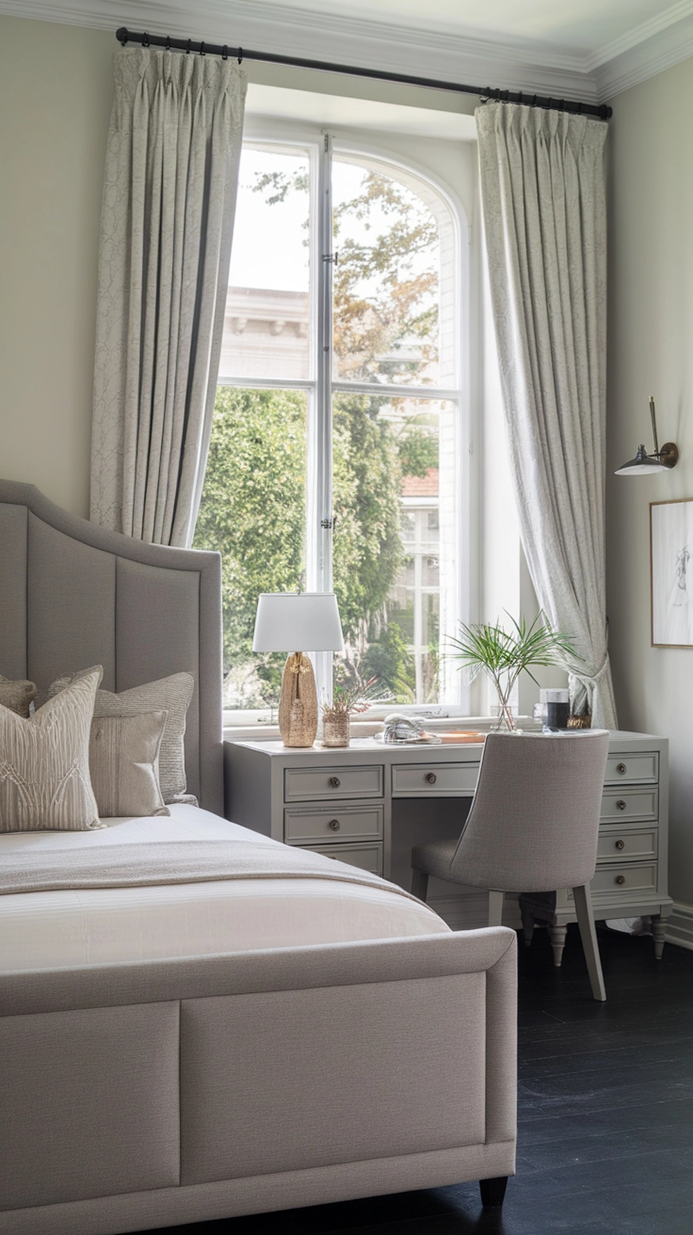 Bedroom with grey upholstered headboard and coordinating furniture