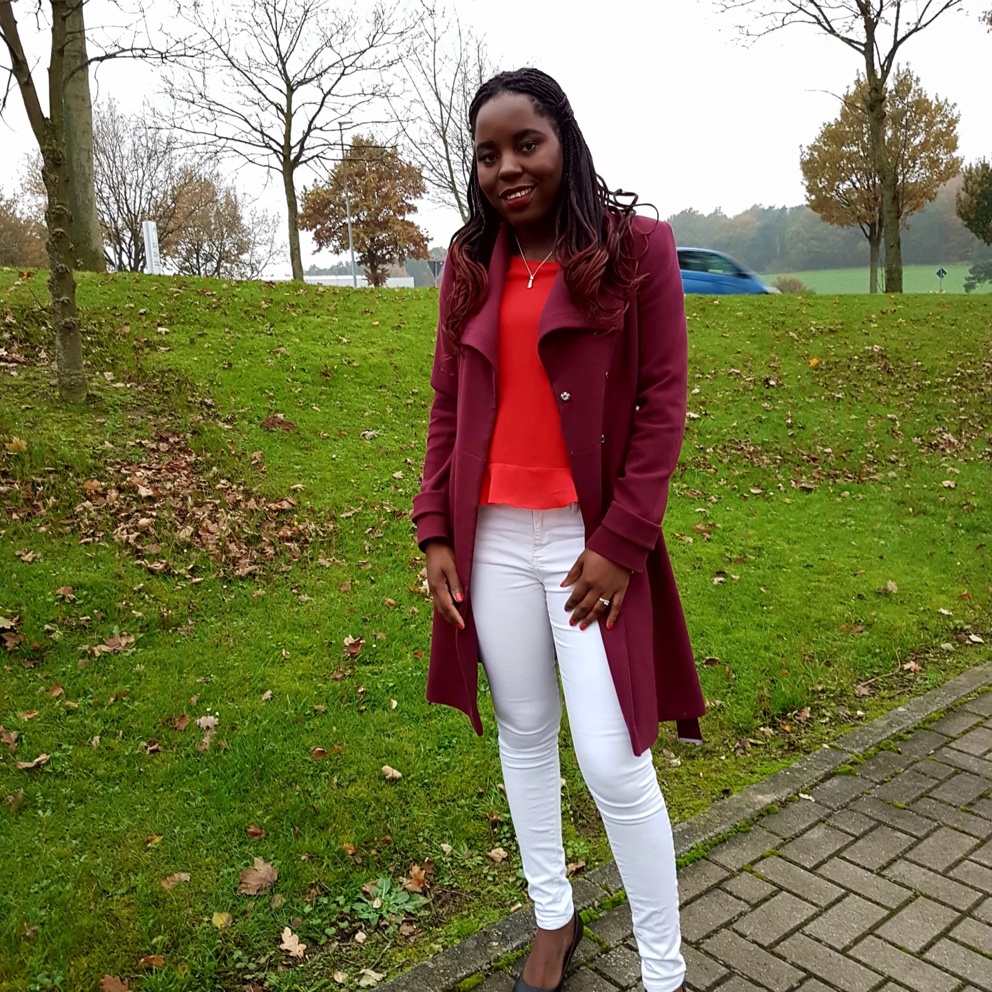 About Me 2 A photo of me wearing a red top with merlon jacket paired with a white jean and black shoes