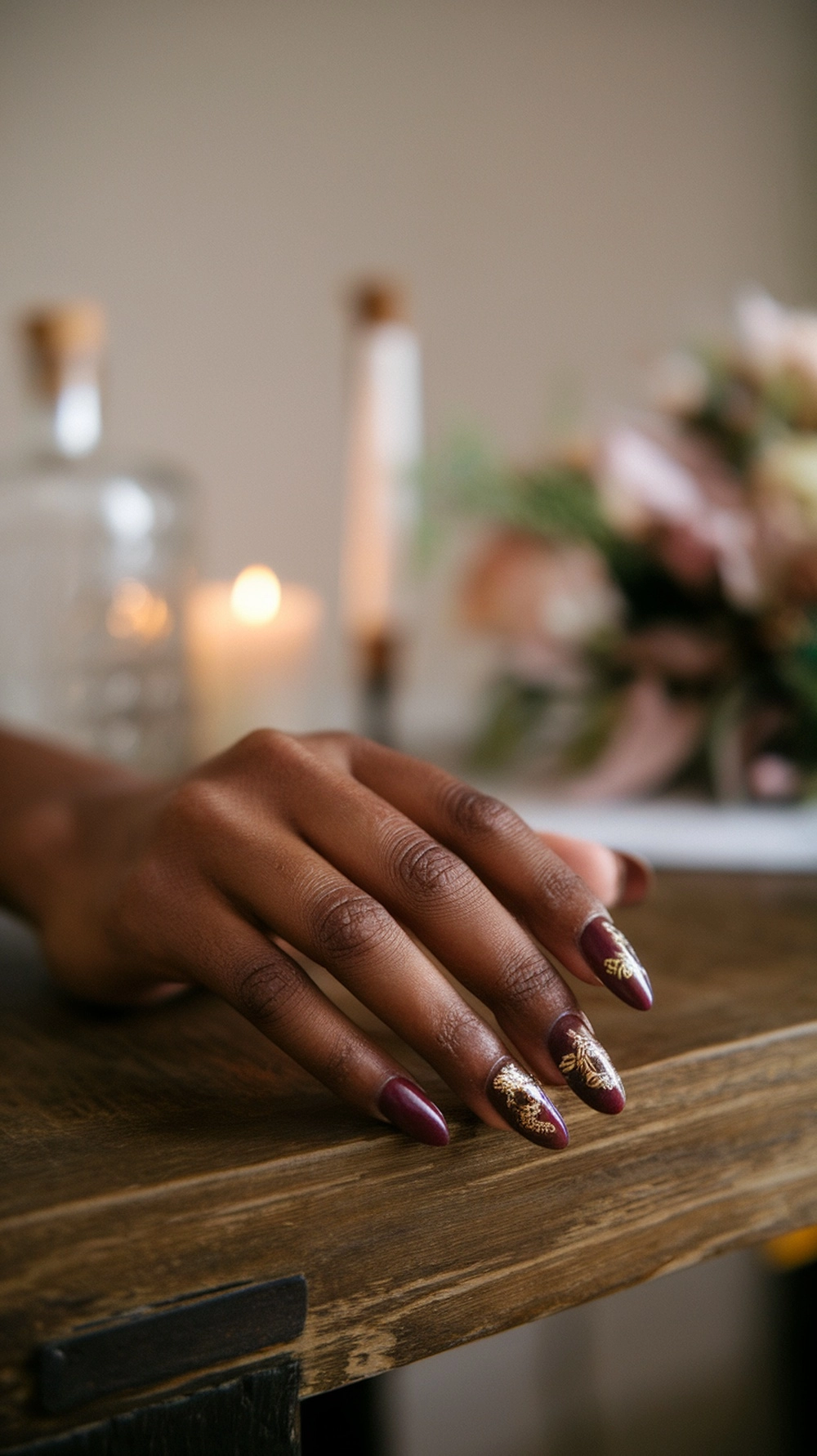 How to Style Burgundy Nail Designs for a Bold Stunning Look 4 Burgundy nails with gold accents on hands