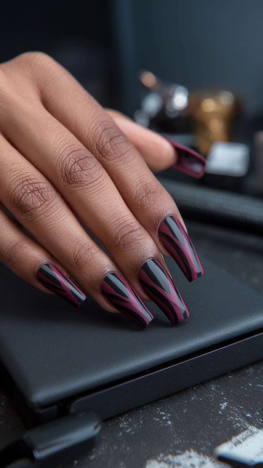 How to Style Burgundy Nail Designs for a Bold Stunning Look 19 Burgundy and black nail design with geometric patterns