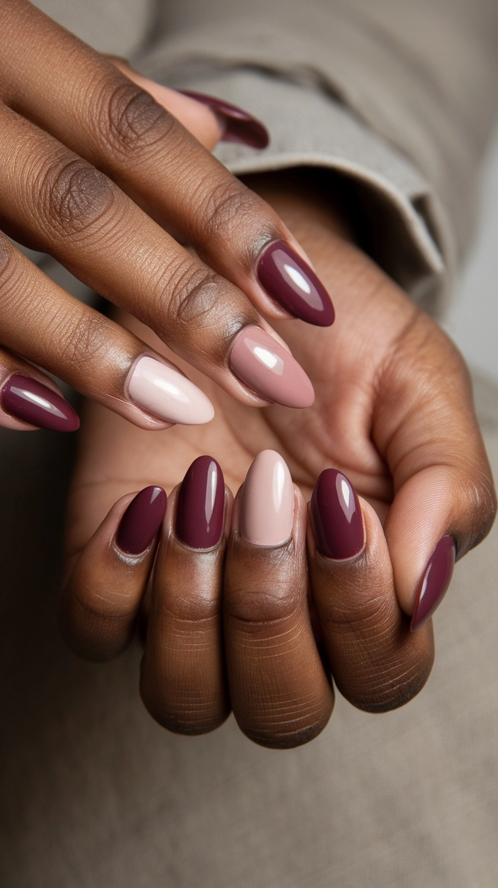 How to Style Burgundy Nail Designs for a Bold Stunning Look 11 Burgundy nails with a matte finish and white polka dots on one nail, showcasing a stylish color block design.