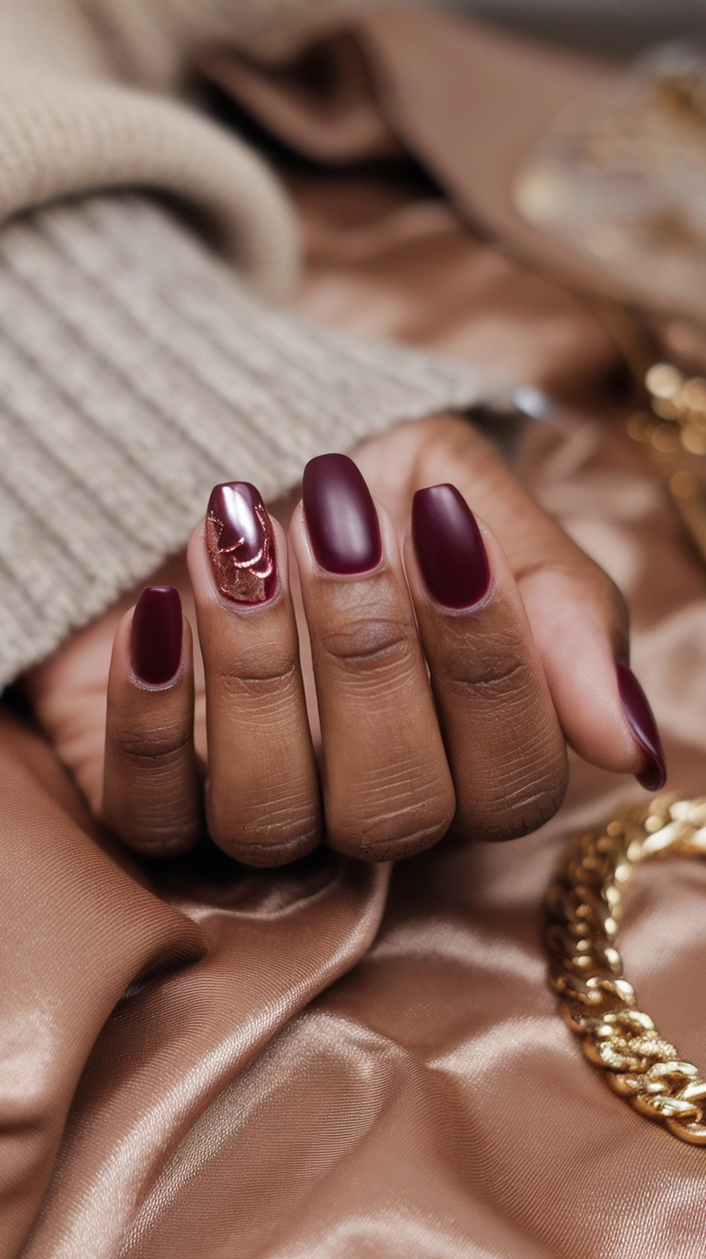 How to Style Burgundy Nail Designs for a Bold Stunning Look 18 Burgundy nails with rose gold accents, showcasing a stylish manicure.