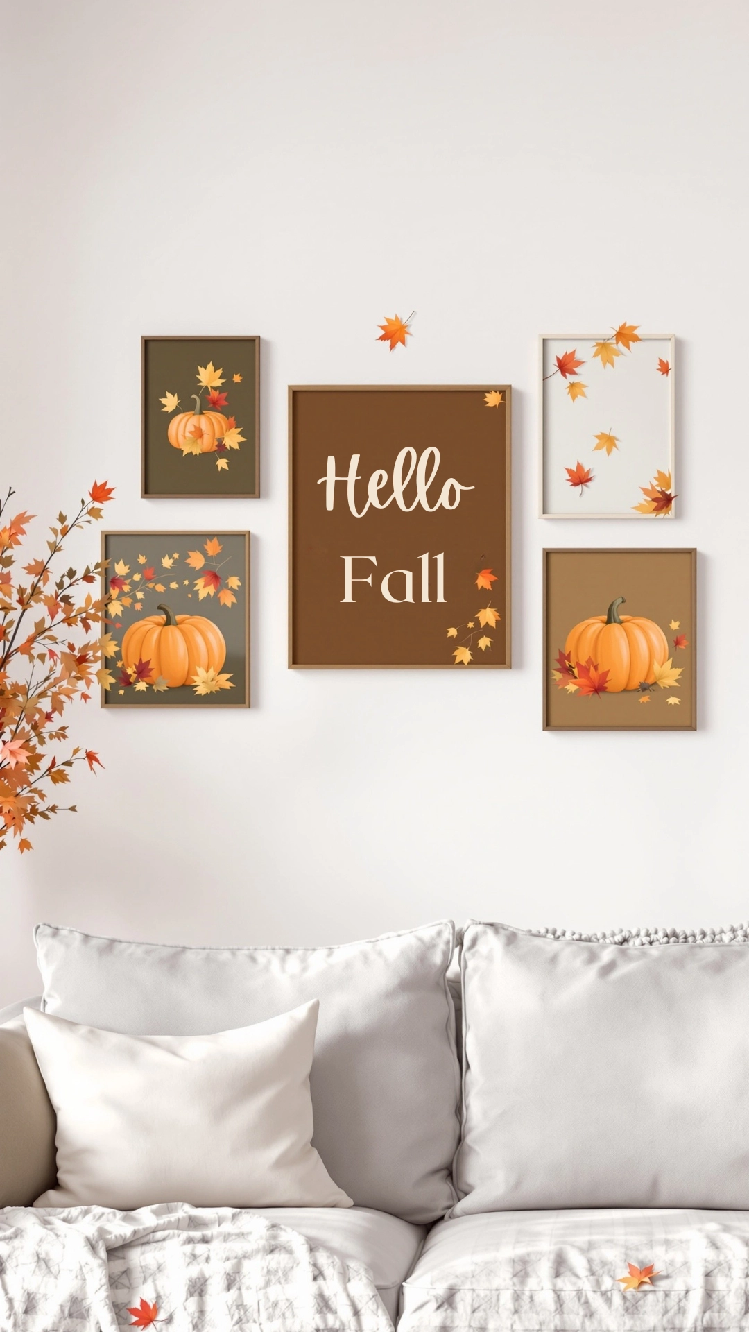A cozy living room wall decorated with seasonal art featuring pumpkins and autumn leaves.