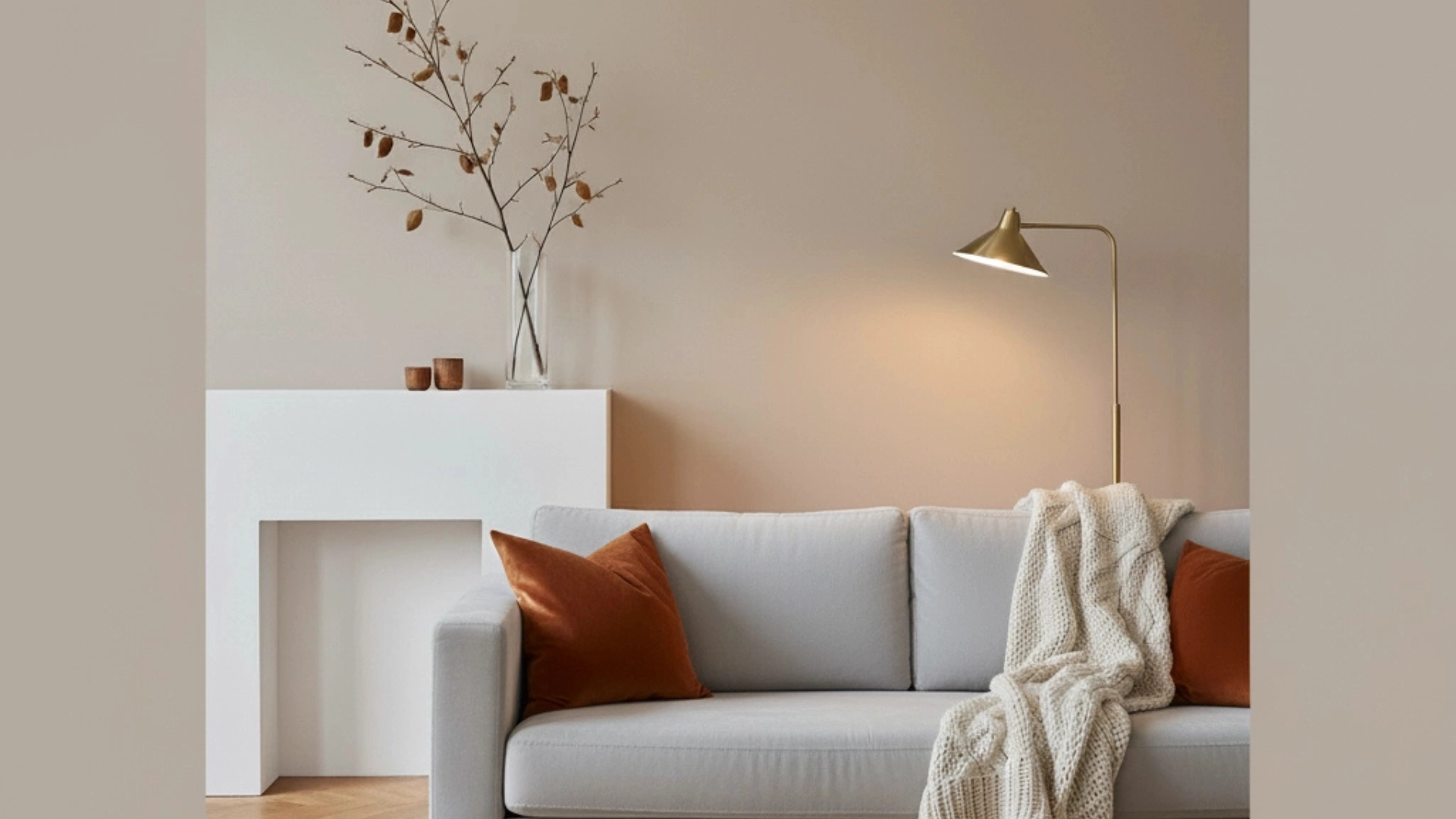 A chic modern living room decor for fall with warm colors, textures, and soft lighting.