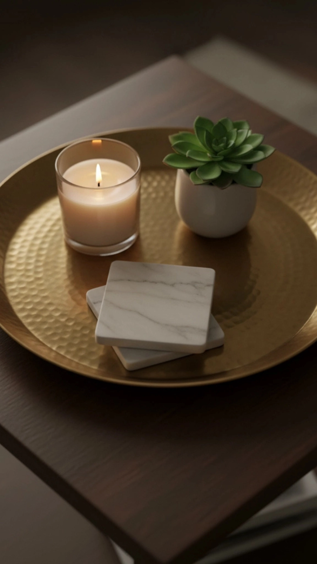 10 Insane Modern Living Room Decor Ideas for Autumn 12 A close-up of a brass tray on a coffee table styled with a candle, adding a warm metallic accent for fall decor.