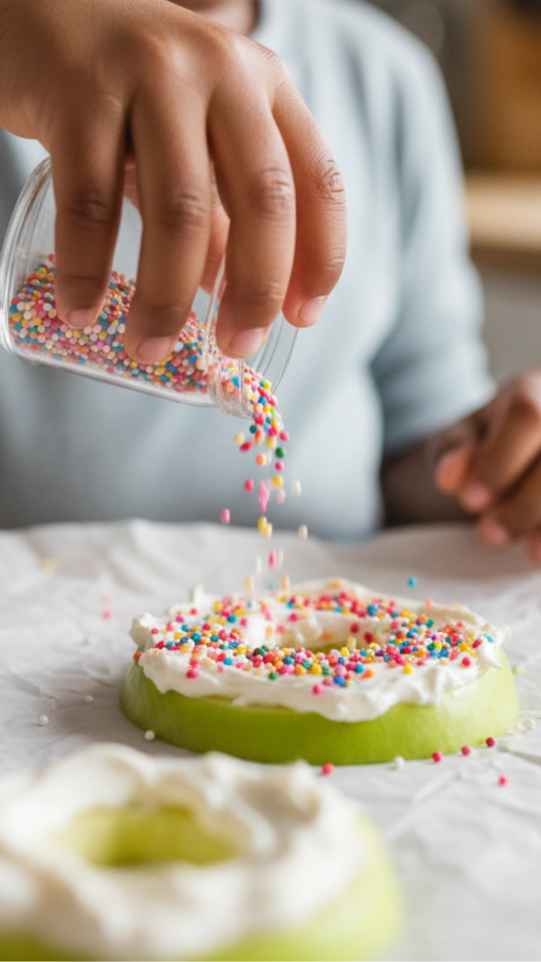 My Top 10 Fun Thanksgiving Snacks for Kids 5 A happy child decorating fun Thanksgiving snacks with their mother, capturing a moment of family fun.