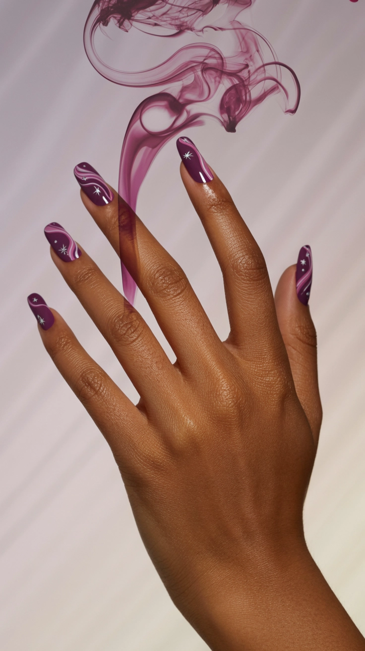 Deep purple and pink marbled nails with silver stars.