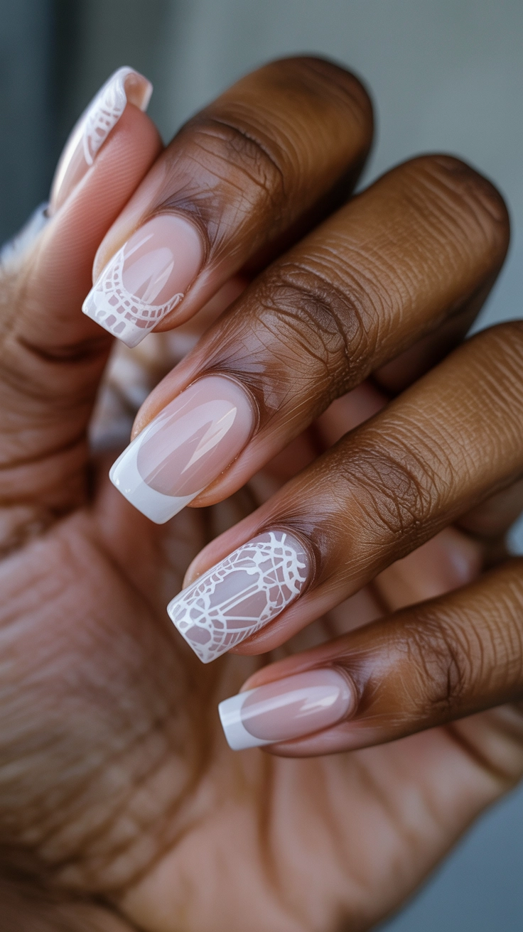 Sheer pink nails with delicate white lace patterns.