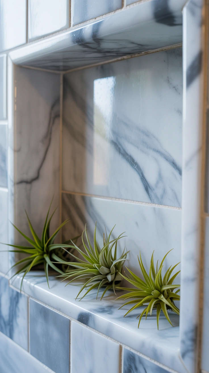 Three small, unique air plants resting directly on the ledge of a recessed marble shower niche.