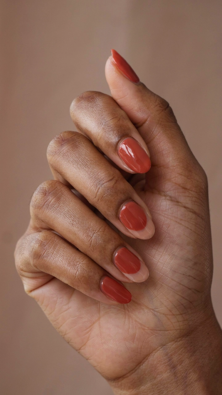 21 Cozy Fall Nail Ideas for a Warm Seasonal Look 21 Rust red half moon manicured nails.